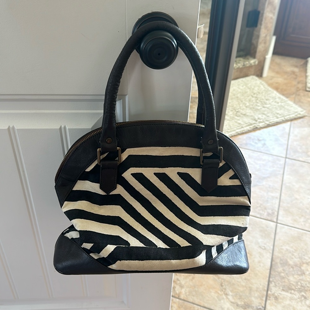 Noonday Collection black and white stripped purse with real leather straps